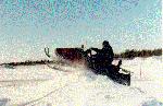 Caroline's Dad showing us how to drive his skidoo